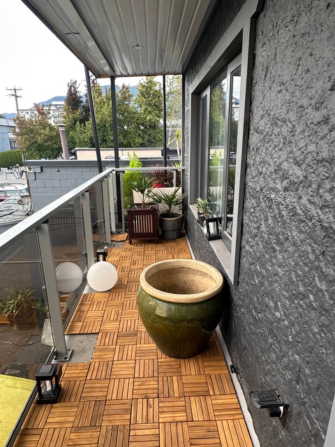 Balcony with planters and lanterns