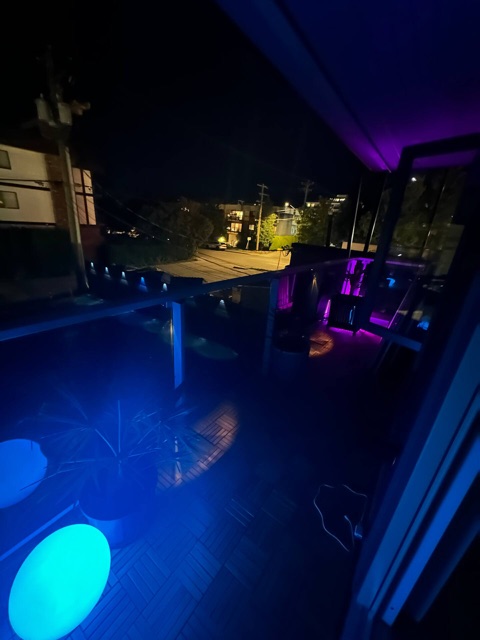 Covered balcony at night with lights