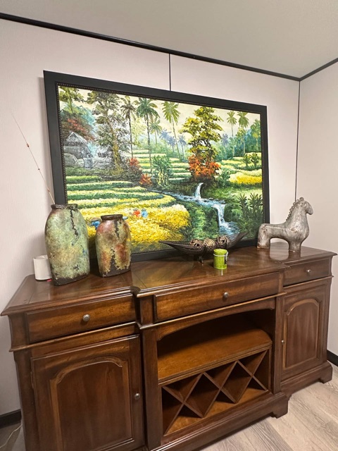 Sideboard with wine rack and painting