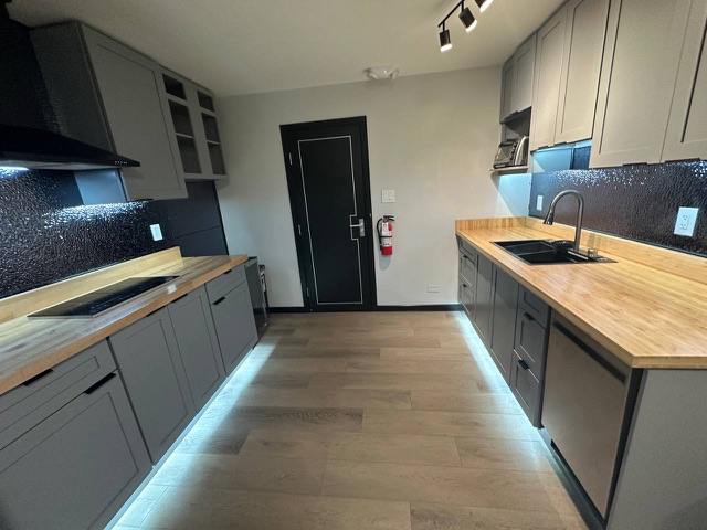 Galley kitchen with under-cabinet lighting
