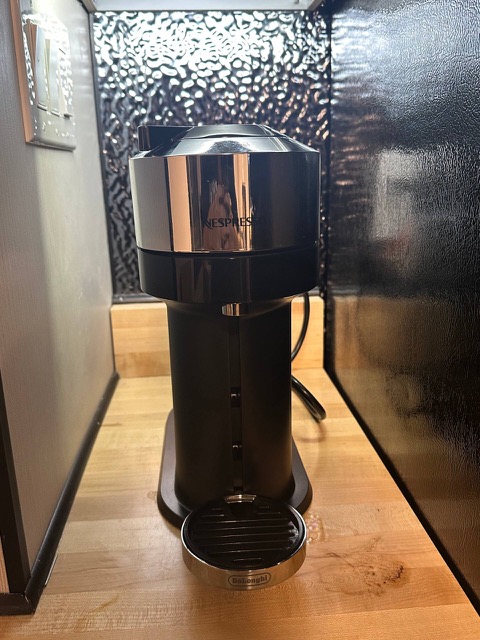 Coffee machine on the butcher-block counter