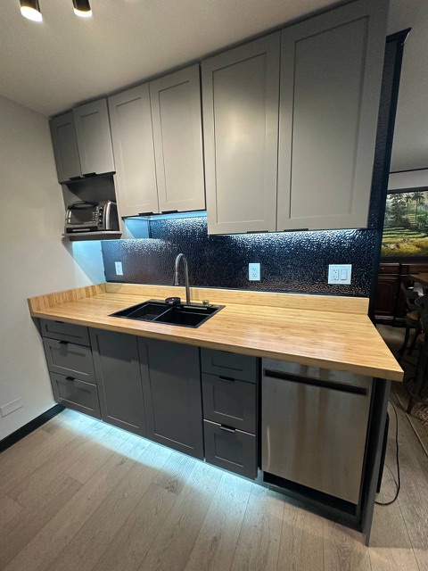 Sink wall and upper cabinets