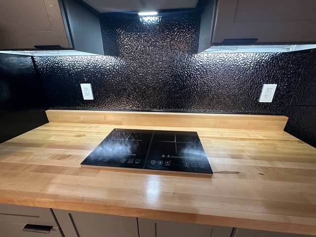 Induction cooktop on butcher-block counter