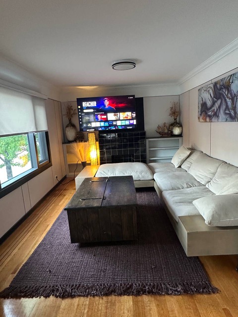 Living room with sectional sofa and TV