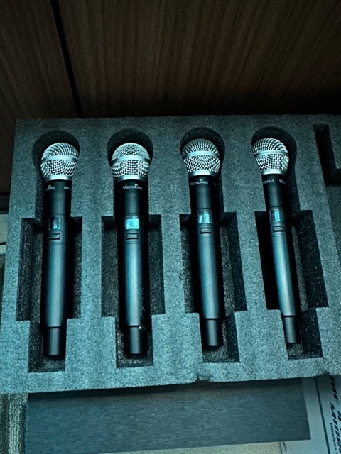 Four wireless karaoke microphones in the cinema room